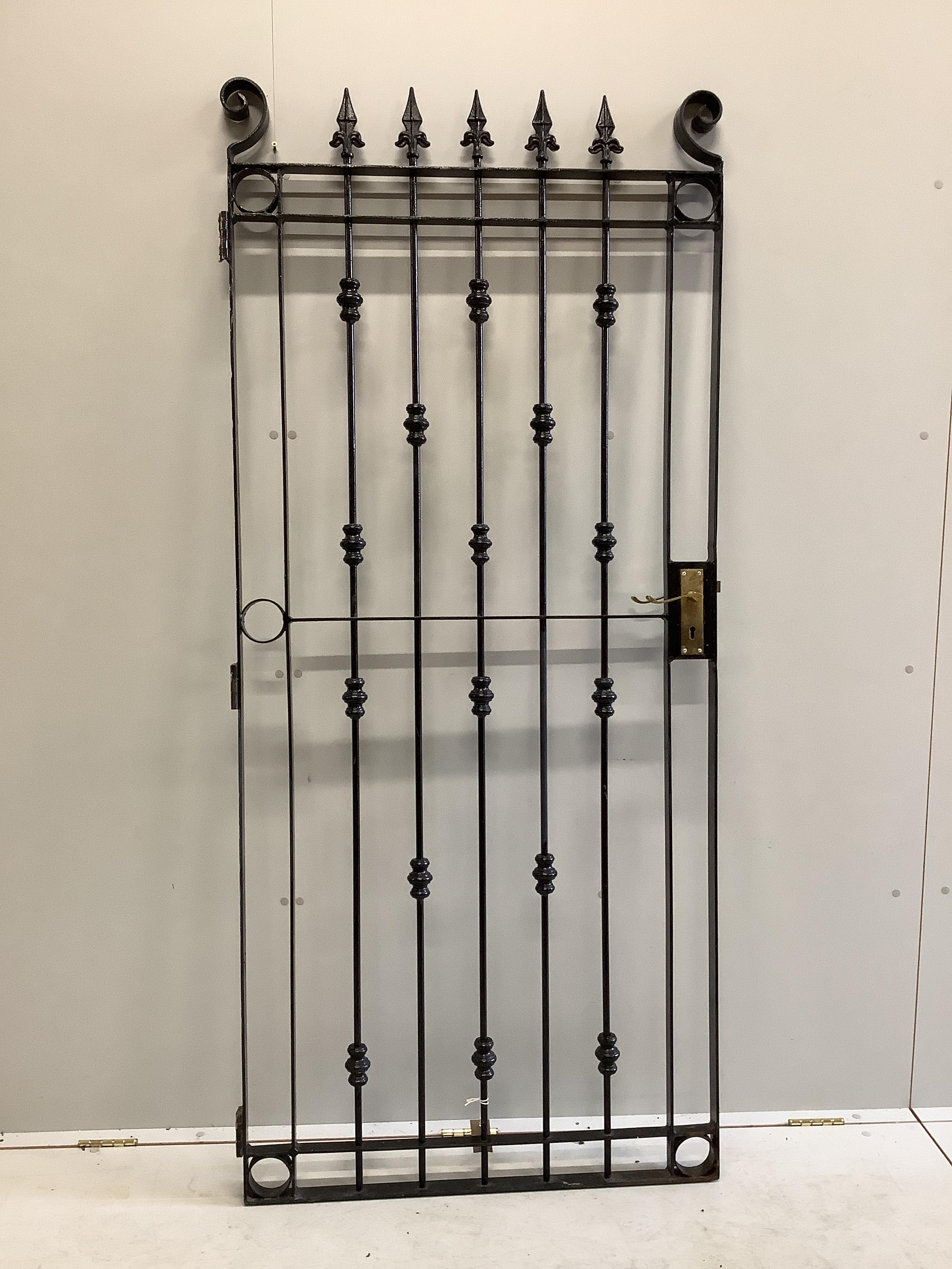 A black painted wrought iron garden gate, width 85cm, height 191cm